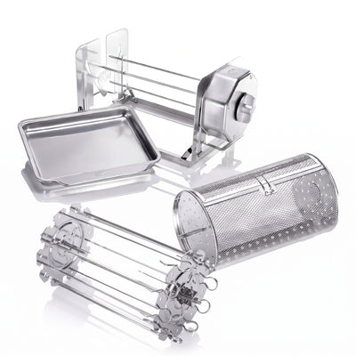 A stainless steel multi-functional rotisserie set including a grill basket, a skewer set, and a rectangular drip tray, displayed on a clean white background with soft reflections.