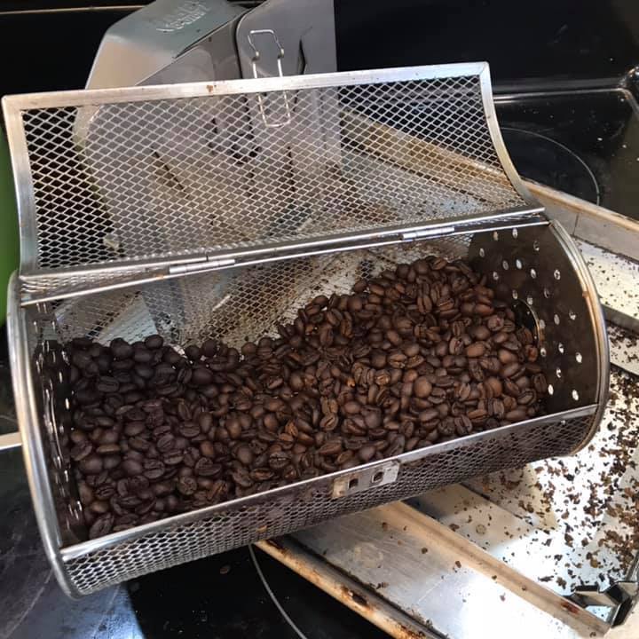 Open ROTO-Q 360 rotisserie (Round) basket filled with freshly roasted coffee beans.