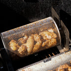 Chicken wings cooking in a round ROTO-Q 360 Rotisserie Basket XL