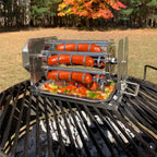 ROTO-Q 360 Sausage Rotisserie holding sausages over an outdoor grill with vegetables in the drip tray.
