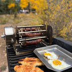 Sausages cooking in a ROTO-Q 360 hot dog rotisserie cradle