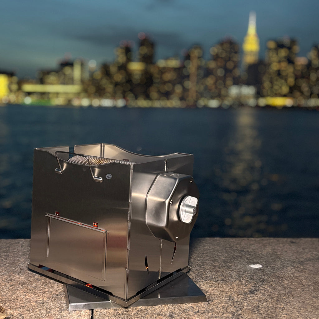 ROTO-Q 360 foldable stainless steel grill set up outdoors