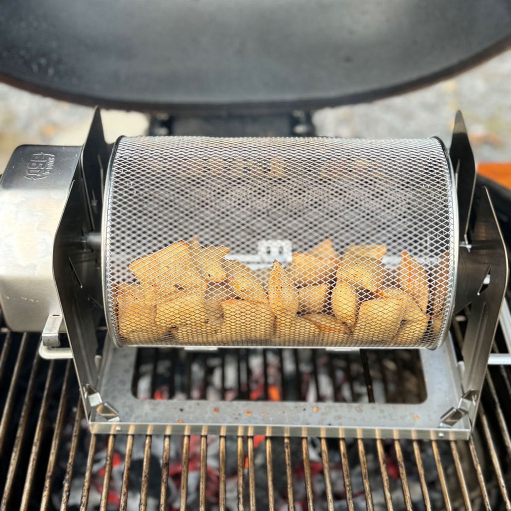 Pizza rolls cooking in a ROTO-Q 360 Rotisserie Basket XL over a grill