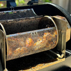 Chicken wings cooking in a round ROTO-Q 360 Rotisserie Basket XL