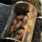 Cooked chicken wings inside an open round ROTO-Q 360 Rotisserie Basket XL
