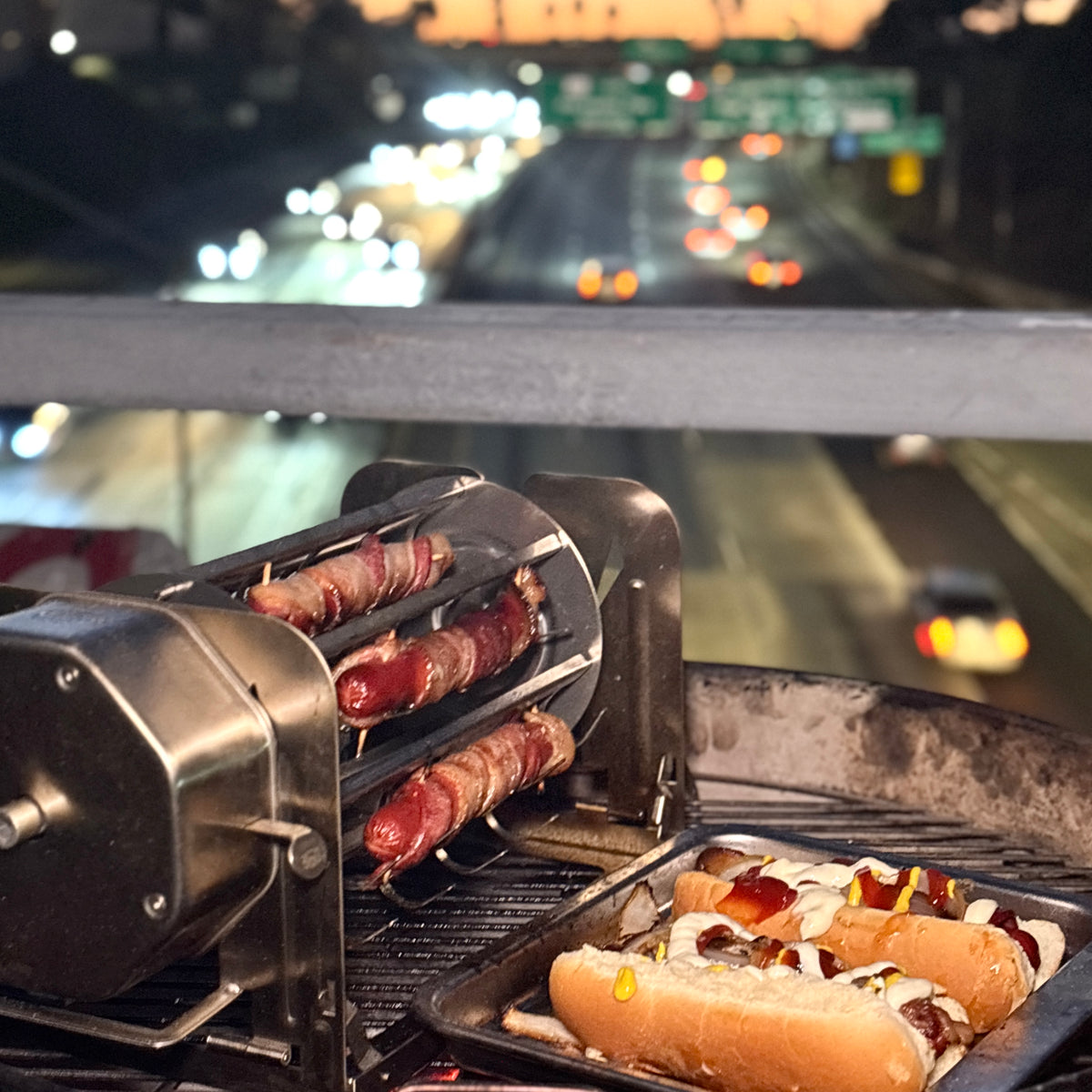 Bacon-wrapped hot dogs cooking in a ROTO-Q 360 hot dog rotisserie cradle