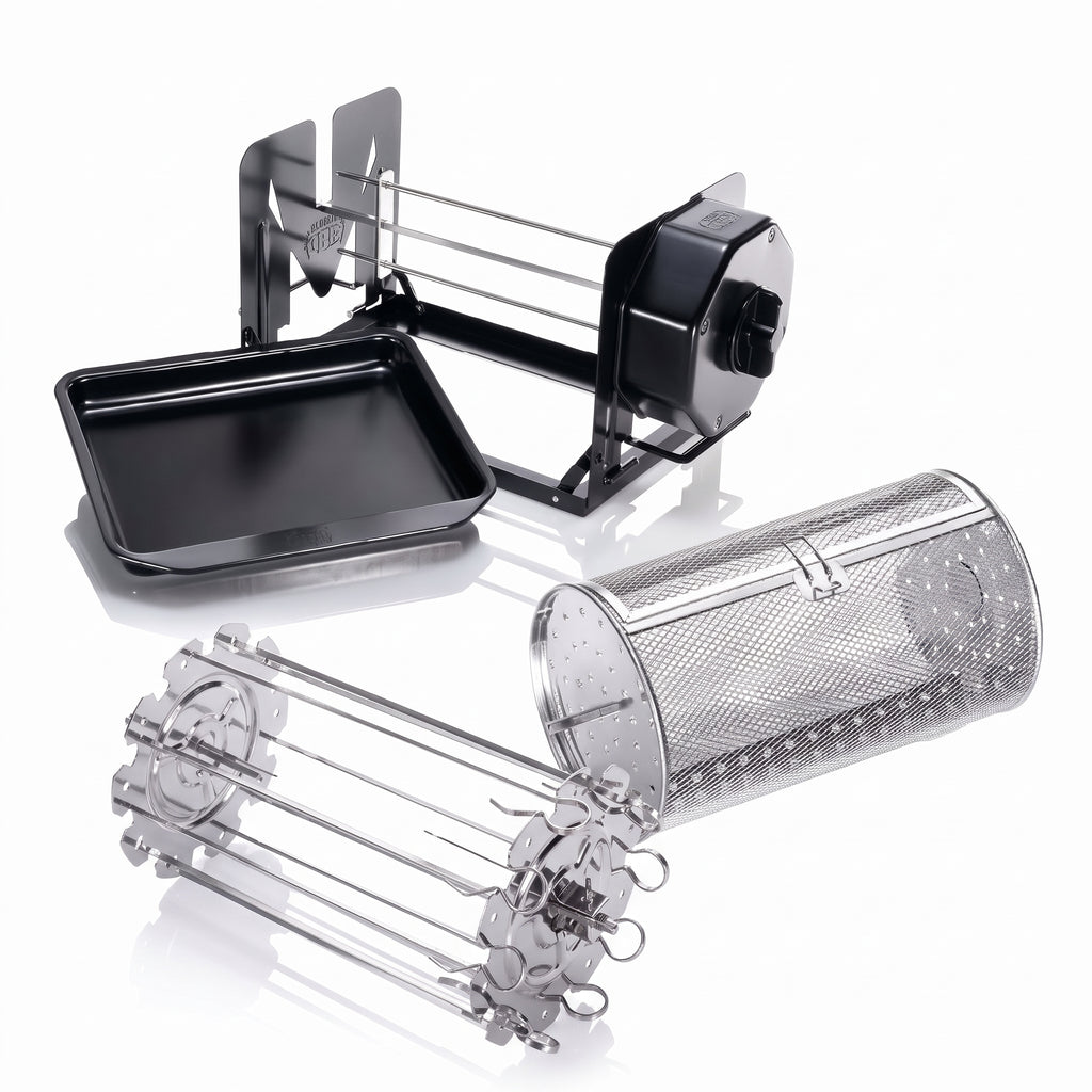 A multi-functional rotisserie grill accessory set including a black rectangular tray, a black and silver metal rack, a perforated stainless steel cylinder, and a silver metal skewer holder, displayed on a clean white background with soft reflections.