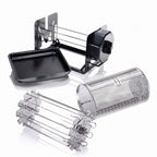 A multi-functional rotisserie grill accessory set including a black rectangular tray, a black and silver metal rack, a perforated stainless steel cylinder, and a silver metal skewer holder, displayed on a clean white background with soft reflections.