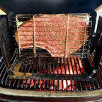 Steak grilling in a ROTO-Q 360 Flatspin basket over flames