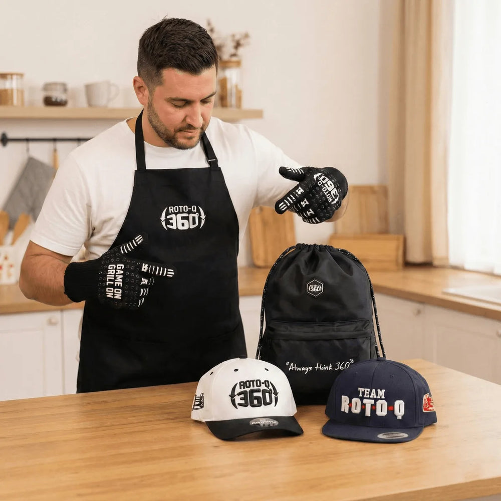Man in a kitchen wearing Roto-Q 360 heat-resistant gloves and apron with branded accessories
