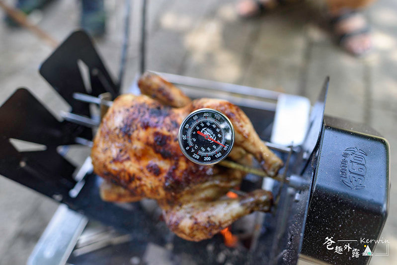 ROTO-Q 360 Meat Thermometer inserted into a whole chicken roasting on the rotisserie setup.