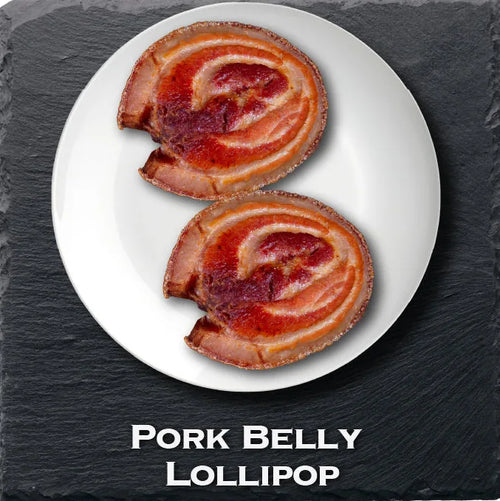 Pork belly lollipops on a plate