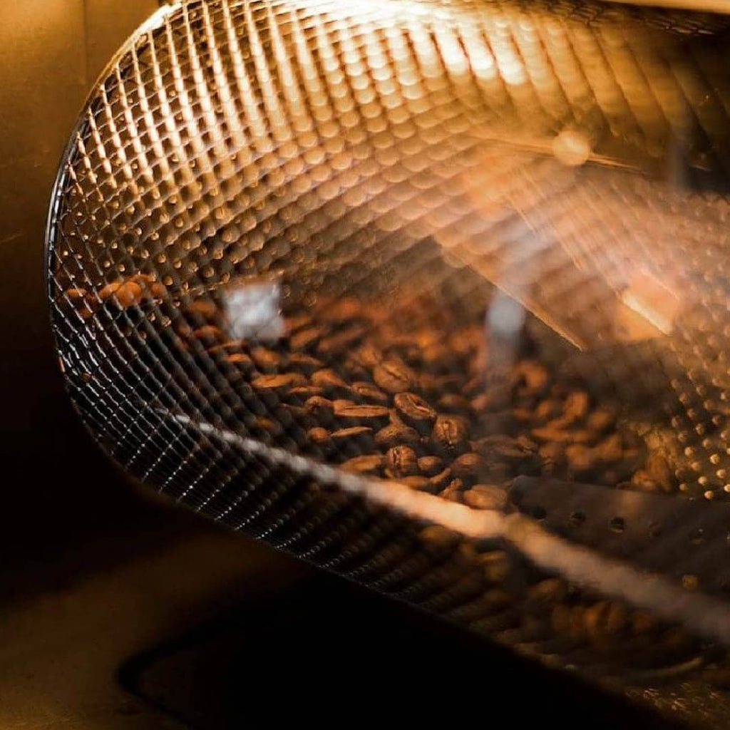 Coffee beans roasting in basket