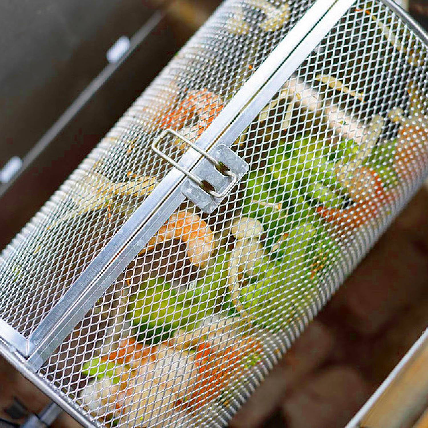 ROTO-Q 360 rotisserie basket (Round) filled with shrimp and green vegetables cooking.